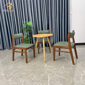Bộ bàn cafe tròn ghế bọc nệm xanh