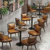 Bộ bàn ghế cafe bành chân bọc inox vàng